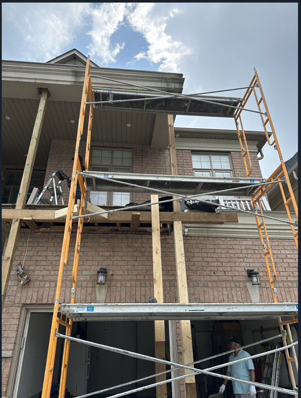 MAINS Contracting construction project with scaffolding around multi-story residential building in the GTA